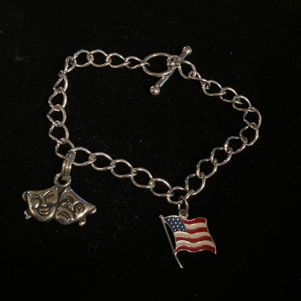 Beau Sterling silver charm bracelet with two charms . Approximate measurements